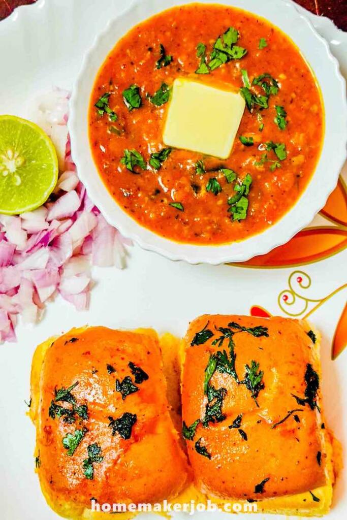 Paavbhaji served hot with two paavs garnished with lime and onions, by homemakerjob.com