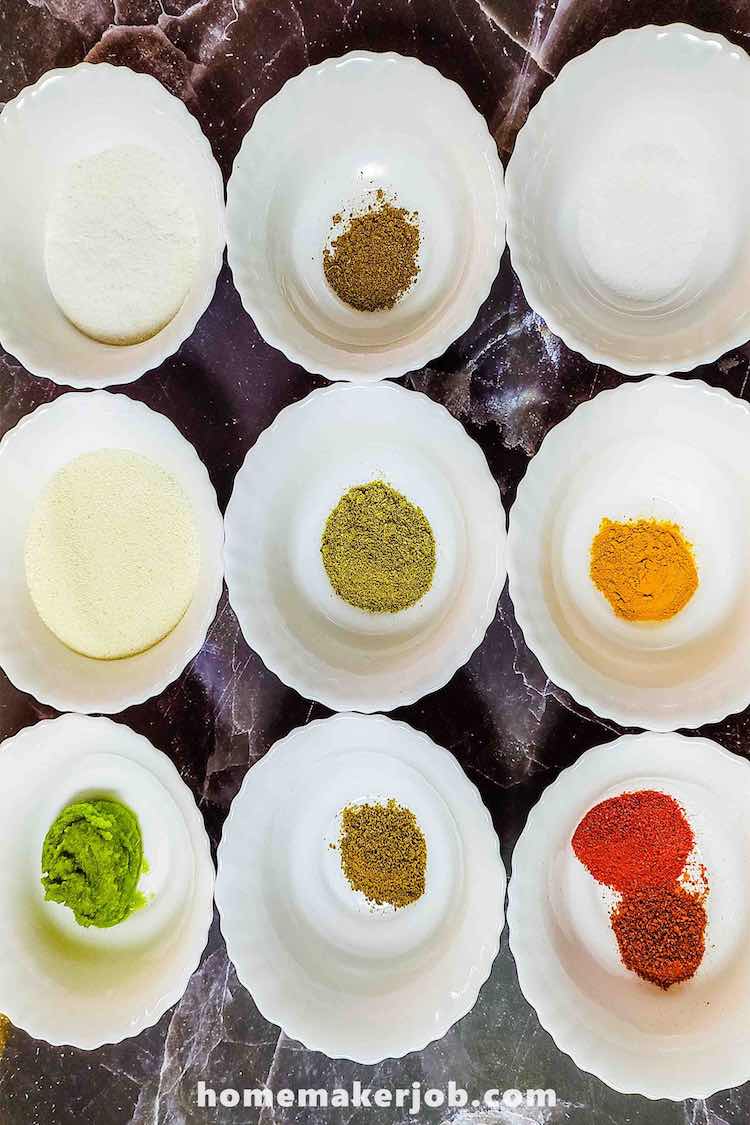 white bowls containing surmai fry ingredients arranged in array