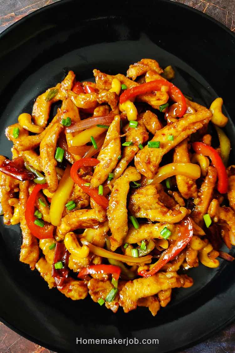 Photo of ready crispy chinese dragon chicken Dry served in a black plate by homemakerjob