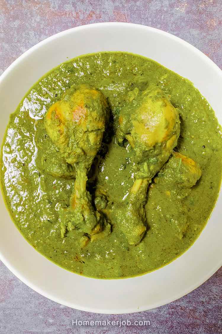 Ready hot palak (spinach) chicken curry served in a white dish by homemakerjob