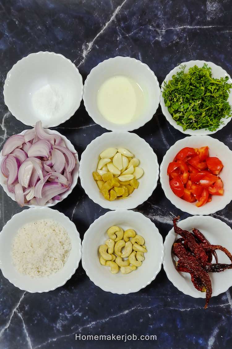 Important ingredients required to make spice mix for chicken sukka recipe are arranged in matrix like grid of white bowls each containing individual ingredient