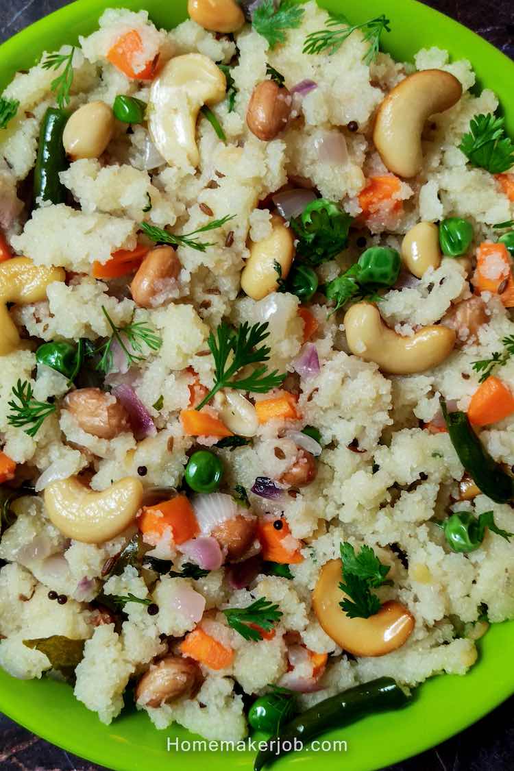 Close up photo of ready semolina upma served in a green plate on a table by homemakerjob