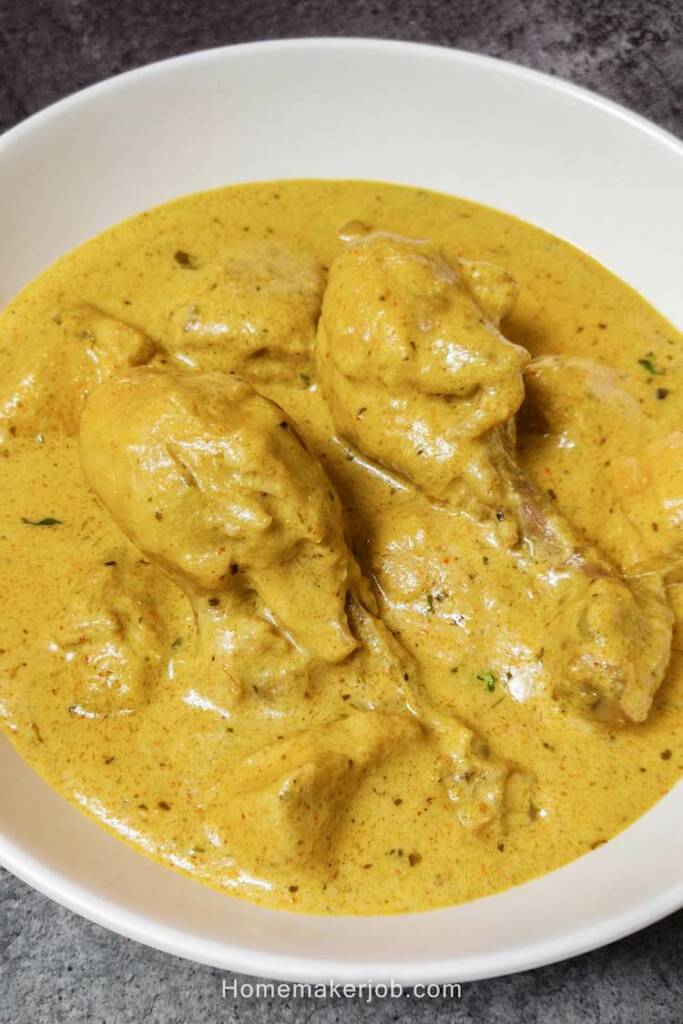 Ready hot reshmi chicken gravy served in a white dish on a table