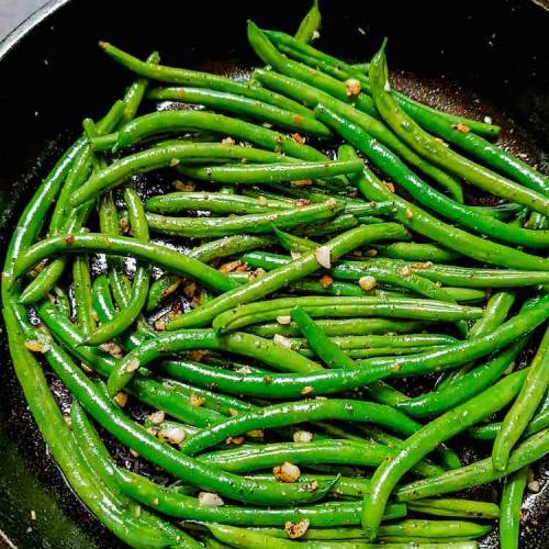 Close up photo of ready hot garlic sauteed green beans by Homemakerjob