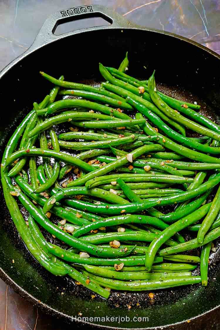 Close up photo of ready hot garlic sauteed green beans by Homemakerjob