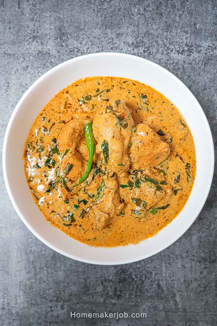Ready tasty methi malai chicken served hot in a white bowl on table top by Homemakerjob,
