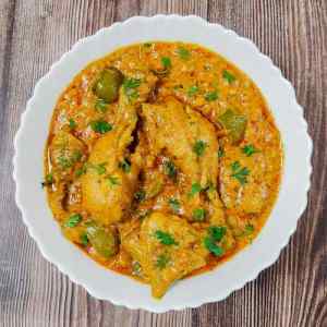 Top view photo of chicken Patiala served hot in a white dish by homemakerjob