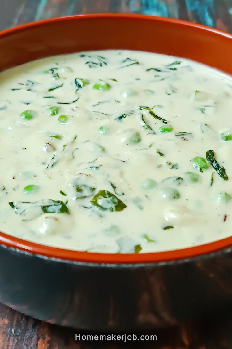 Close up photo of ready creamy methi matar malai served hot in a clay pot, on a table, by homemakerjob.com