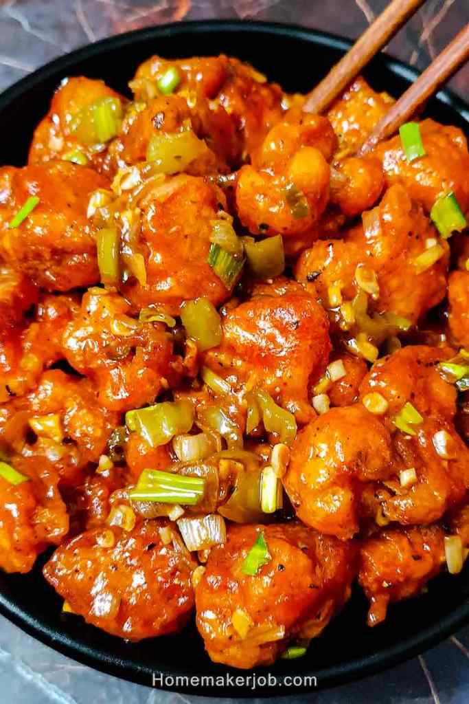 Close up photo of dry cauliflower manchurian served hot by homemakerjob.com