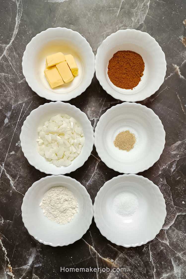 A top view photo of curried eggs recipe ingredients in white bowls arranged in two vertical rows on a table for a recipe by homemakerjob.com