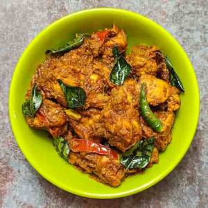 Top view photo of chicken peratal in a light-green bowl on a table, a recipe by homemakerjob.com