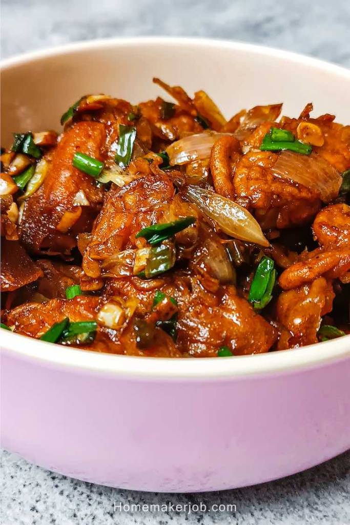 Side-Top close-up view of egg manchurian dry in a bowl on a table, a recipe by homemakerjob.com