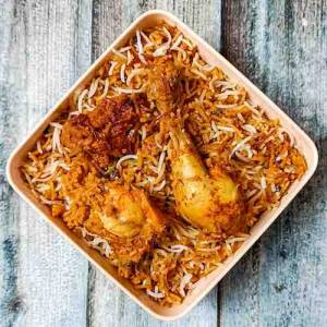 Top view of ulvacharu biryani in a square bowl on a top of table, a recipe by homemakerjob.com